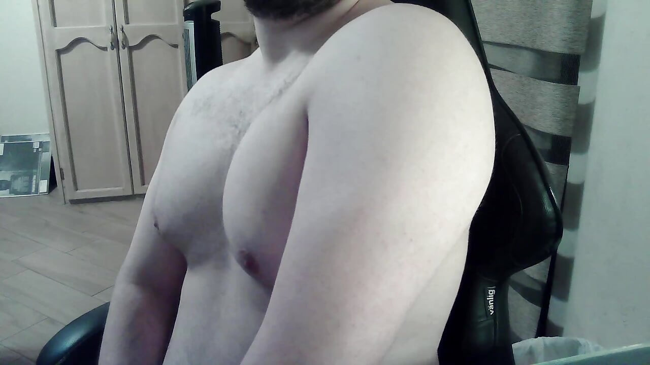 Hot beefy camboy shows off the goods during a show