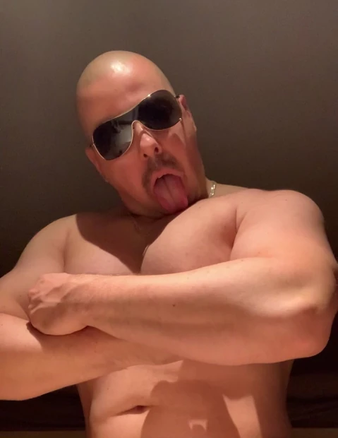 beefy slut licks his tits