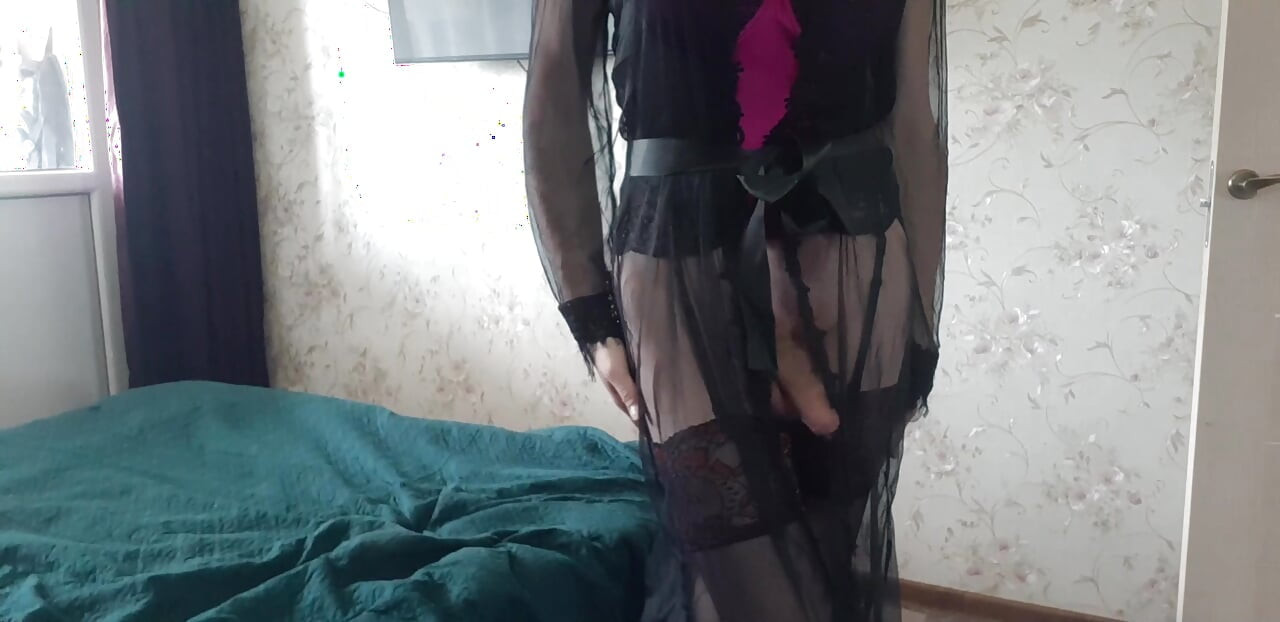 Seducing in a black sheer robe