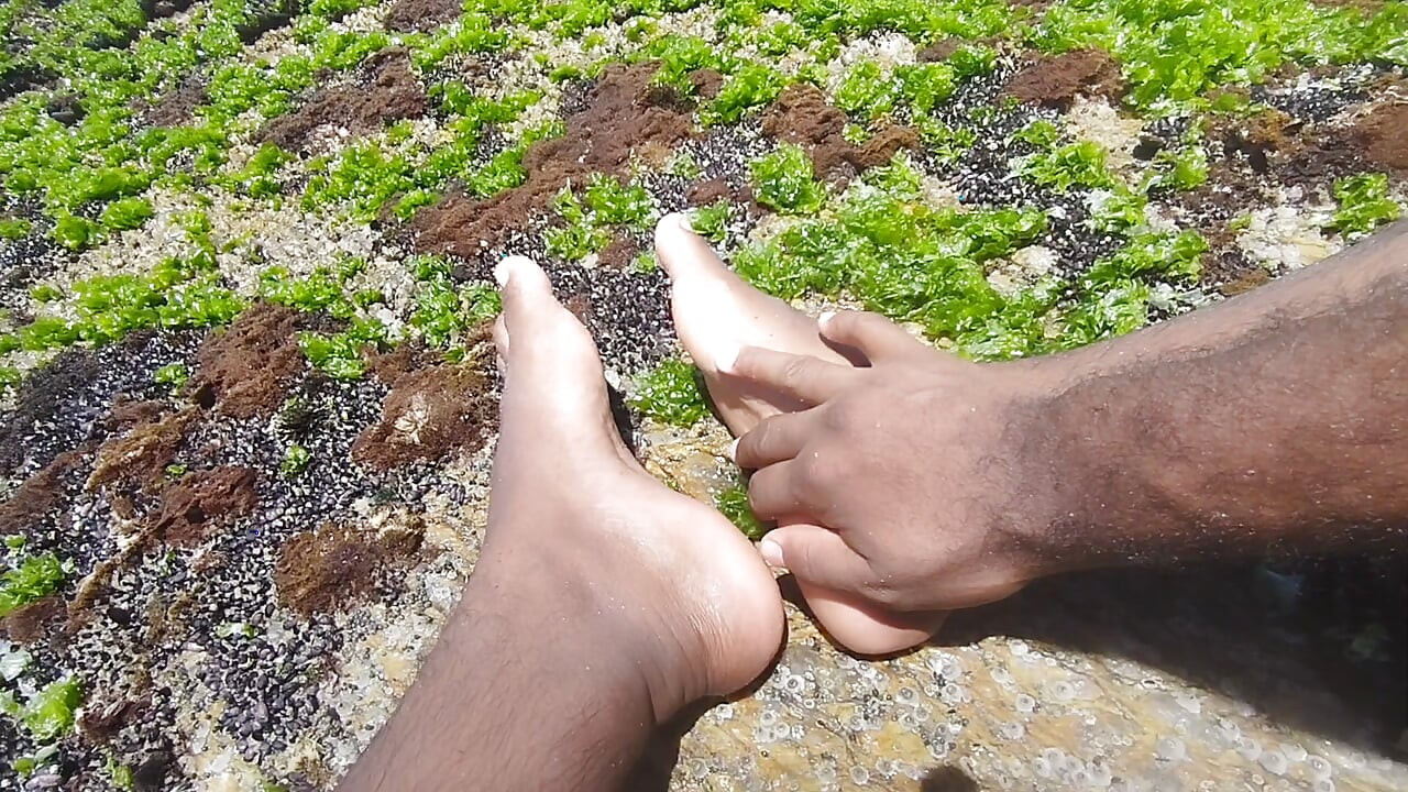 massaging my feet on the beach