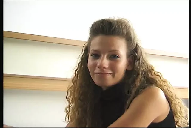 cute girl lolls on the bed and shows her willing cunt