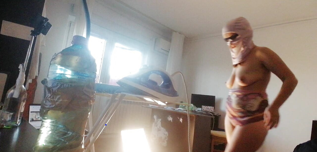 Amateur wife doing housework naked. Sexy and naughty wife trying on the clothes she cuts.