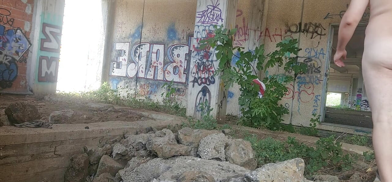Naked boy in an abandoned building