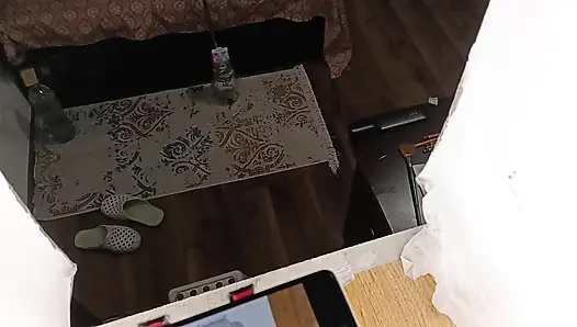 Sexy brunette doing naked chores around the house.
