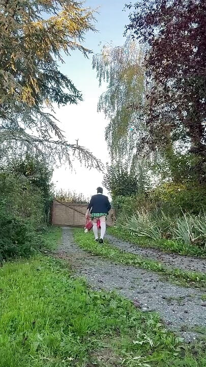 Dressed in a little plaid pleated skirt for a night out