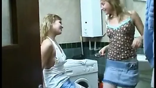 Sisters have fun in the bathroom. )