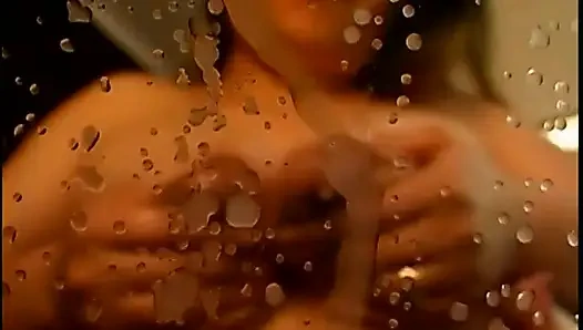 Asian girl is milking her tits in the mirror for you