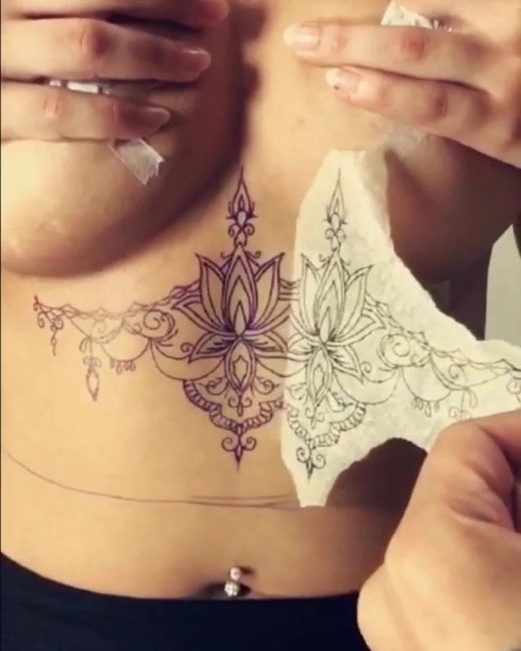big tits babe getting inked