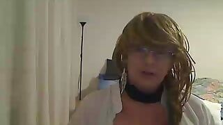 horny MILF tranny showing off and petting on webcam wearing a short dress, white blouse, fishnet stockings and heels