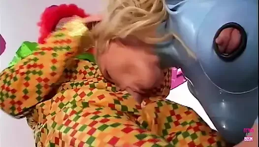 Gorgeous Blonde Jodie Moore Lets a Creepy Clown Pound Her Asshole Before Tasting His Cum