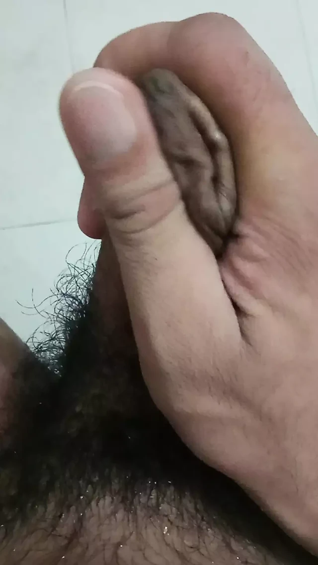 Young boy playing with dick