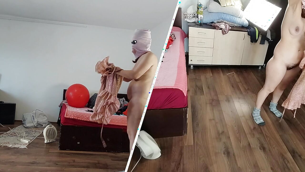 Amateur wife dancing naked at home. Amateur woman has fun trying on clothes and cutting them.