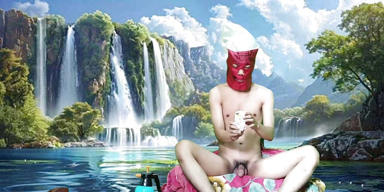 Masturbating with a dildo made from a bottle, used under a waterfall.