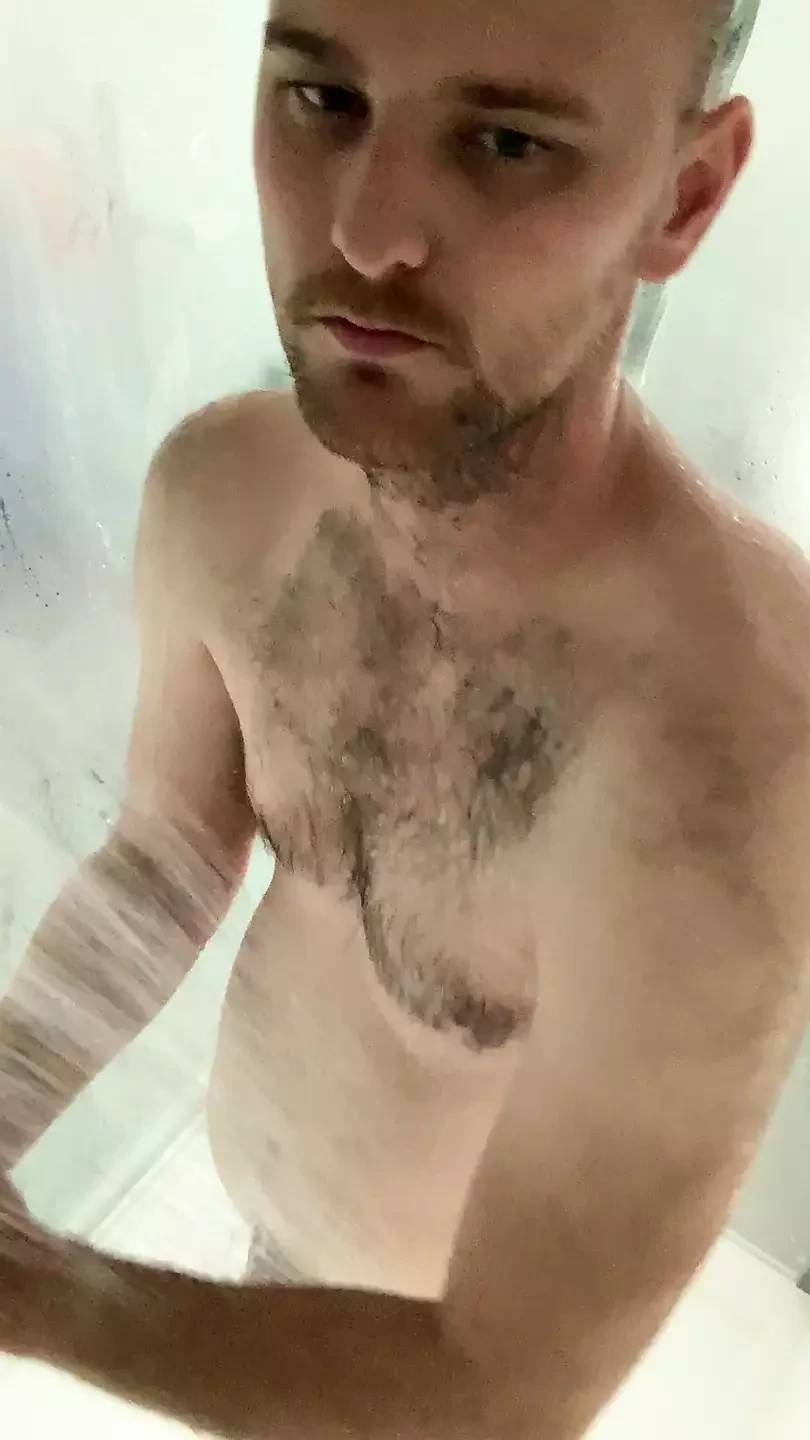Boy goes to have a shower on a cold winters day to warm up