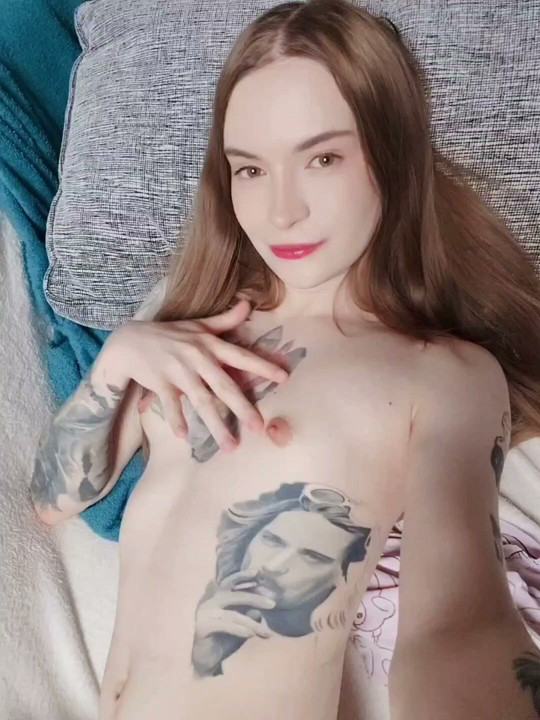 A shemale caresses her sensitive nipples