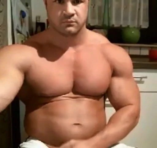 Handsome muscular guy stroking