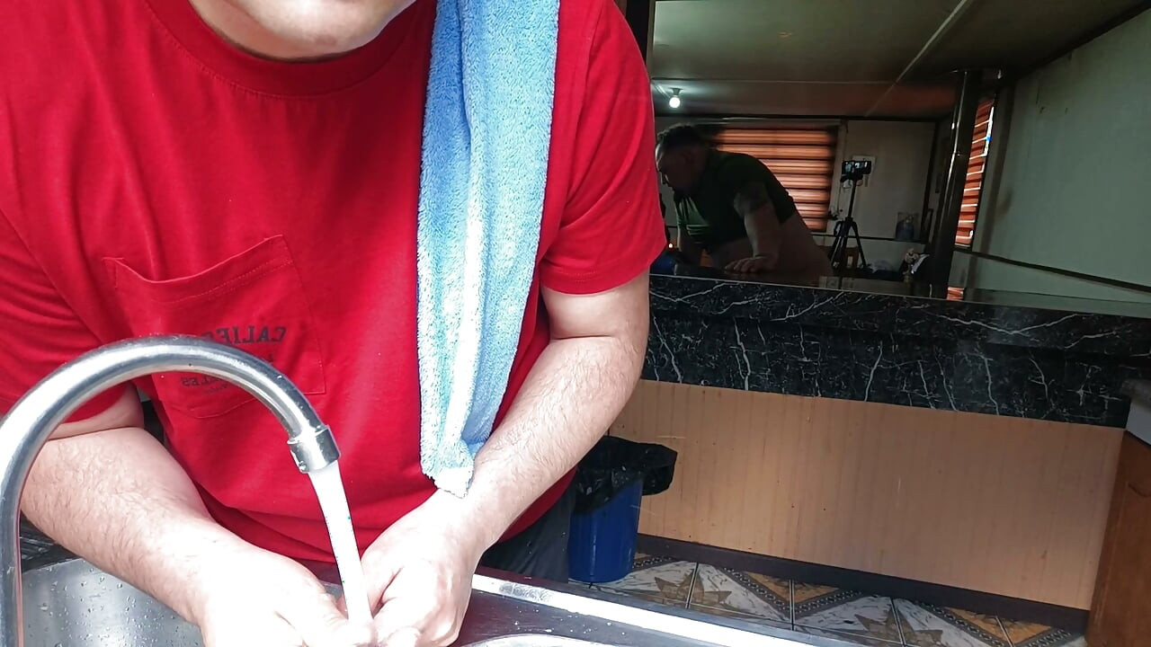The cuckold is in the kitchen while his friend fucks his unfaithful wife right there.