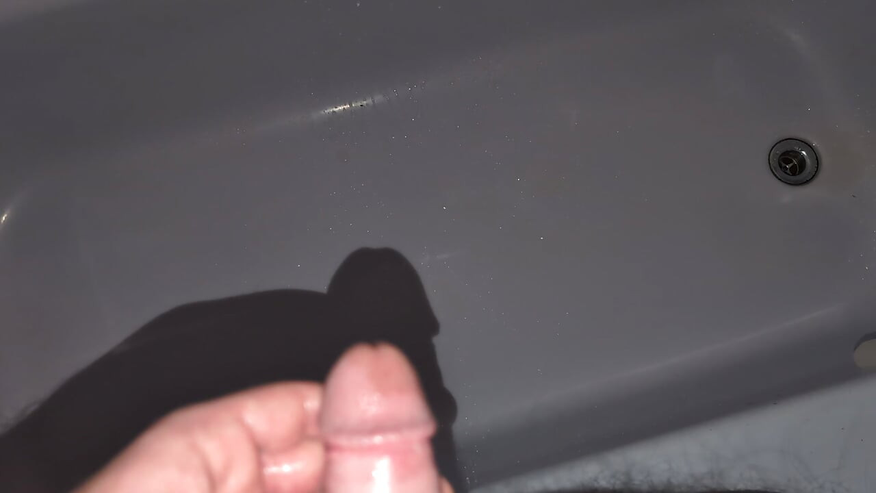 Cock pissing in the bathtub