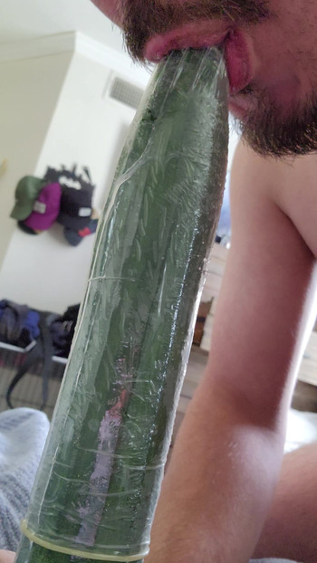 Horny bottom tries to deepthroat cucumber