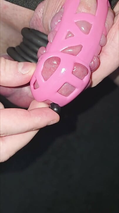 Accidentaly inserting my penis plug all the way into my cock while wearing a pink cock cage and many cock rings around my balls.