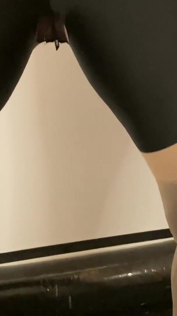 Iconic moment from "Spandex, Nylons, Heels Pissing and Masturbation Bondage"