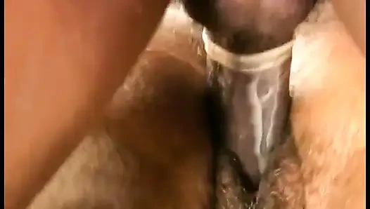 Thin black guy gets a blowjob from an unshaven bitch that loves doggy style fuck