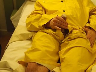 Filling up a condom in a yellow raincoat