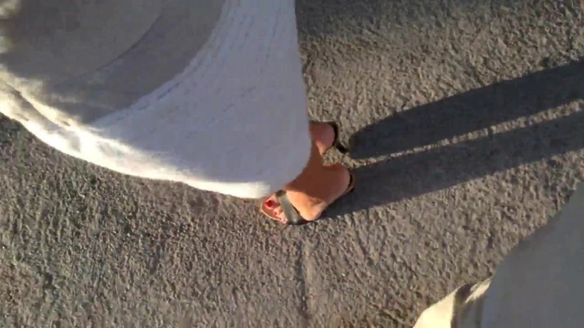 walking in wooden Guess mules 1