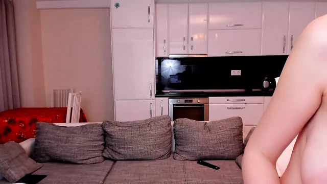 Purple haired Deea teases with her perky tits