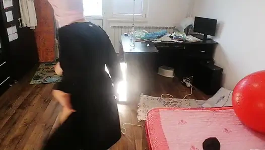 Amateur woman has fun trying on clothes and cutting them.