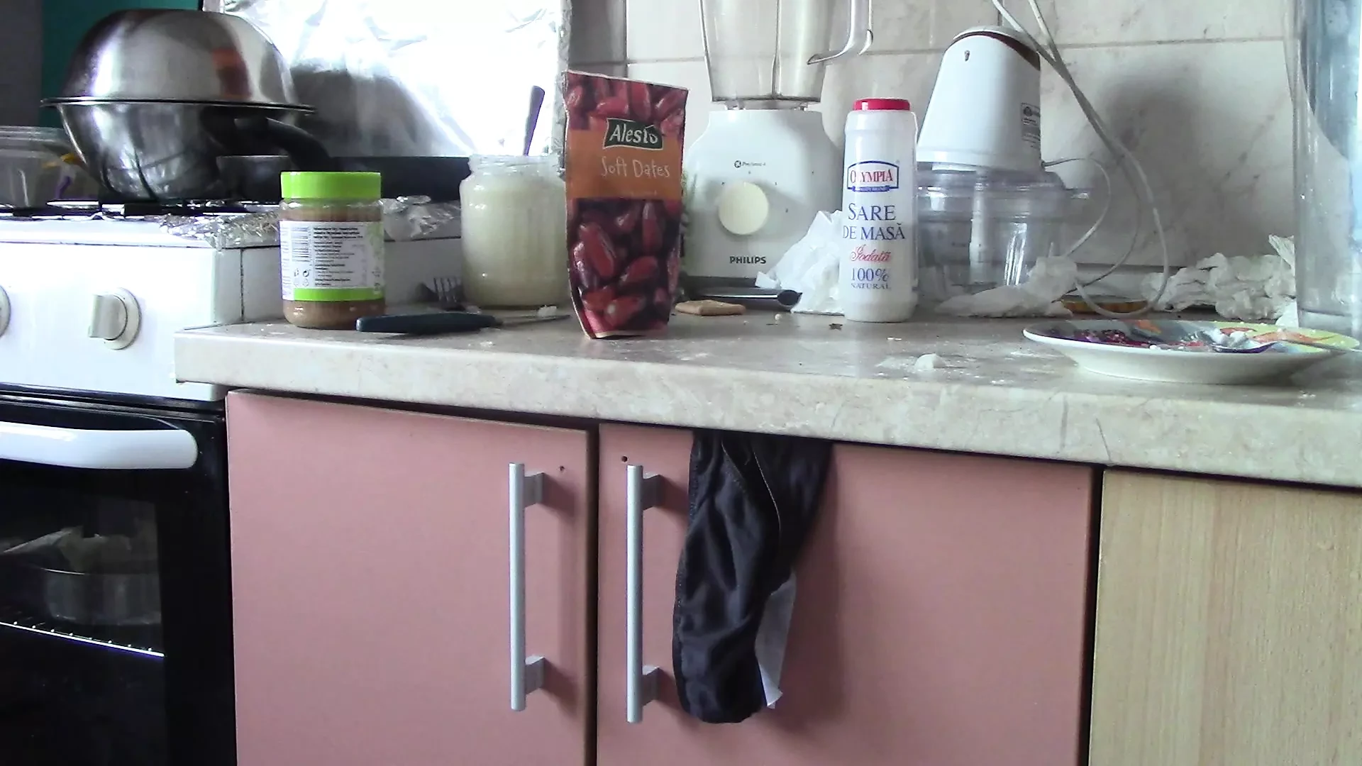 Sexy naked woman preparing food in the kitchen. Hairy brown hair, big ass, big.