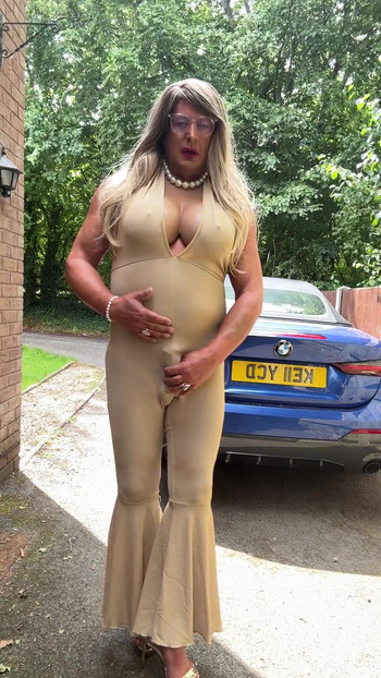 Emotional moment from "Sexy Crossdresser kellycd2022 in gold stretchy catsuit and heels"