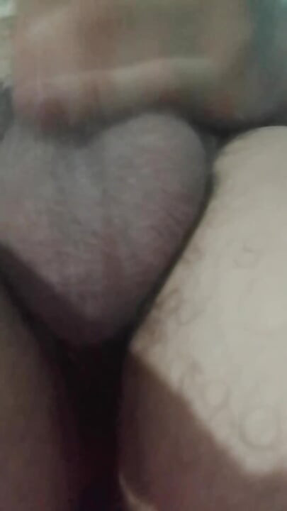 Masturbation, showing the testicles of the penis