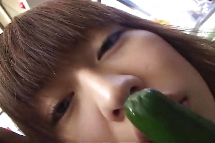 Insatiable Young Wife Drenches Cucumber Deep in Kitchen Sink