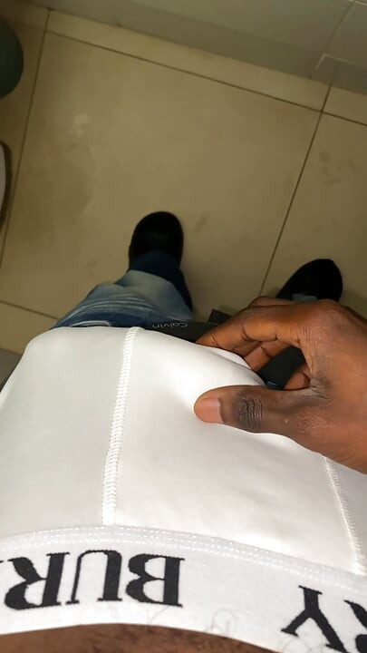 Thug beating his meat in the office