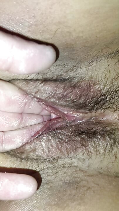 She spread her legs so that she could be fucked with her fingers in both holes