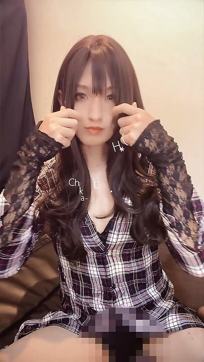 A video of a casual black-haired crossdresser quietly masturbating