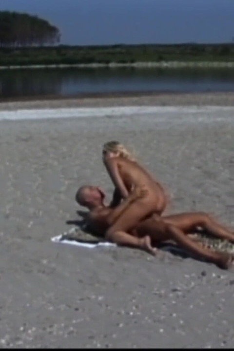 Bitch sucks a huge cock then gets fucked hard on the beach