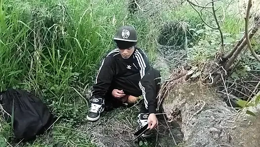 Cute Asian gay twink in a black-and-white adidas tracksuit and Campus sneakers masturbates and cums outdoors