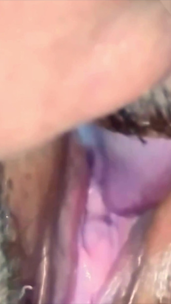 Close-up: her clit pulses as I lick her pink wet hole