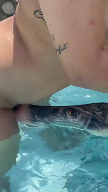 Iconic moment from "Sunny day at the pool! My best friend jerks me off in the pool until I squirt! Naty Delgado"
