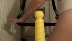 Mature with anal dildo while on bike