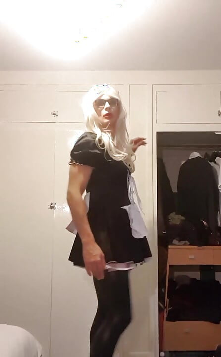 Sissy maid posing in latex stockings