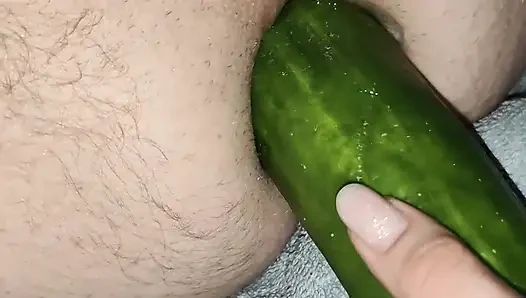 My wife is fucking my ass with a huge cucumber.