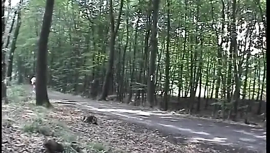 Redhead chick plays with her pussy outdoors