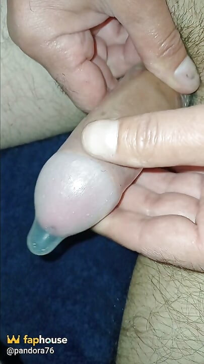 Male Penis in a Condom Cums, Sperm Inside!