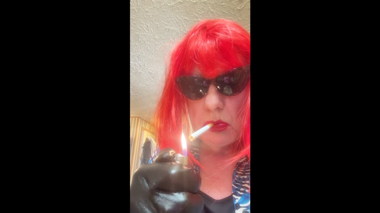 MRS. ROMAN DESTROYING A MARLBORO 100 MENTHOL CLOSE UP - WITH DANGLING AND NOSTRIL EXHALES