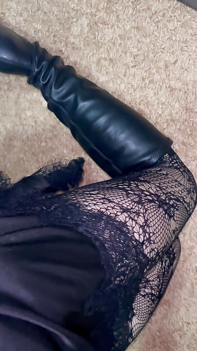 Long legs in black stockings snd boots