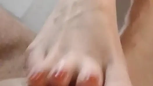 Kelly performs a technical footjob bringing Dominik's cock to a squirting orgasm.
