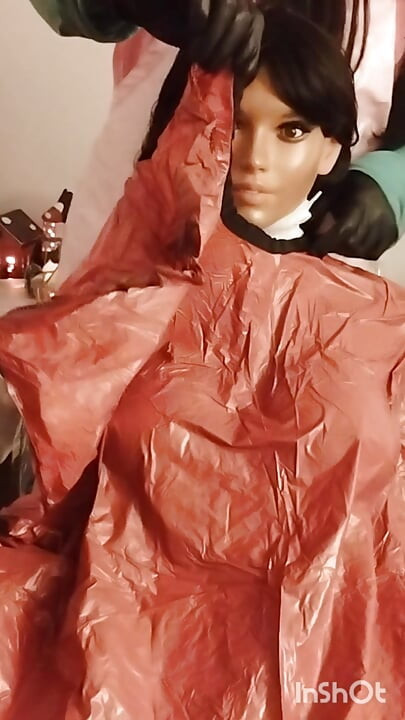 Ebony Sex doll Nikki shows off vinyl shampoo capes